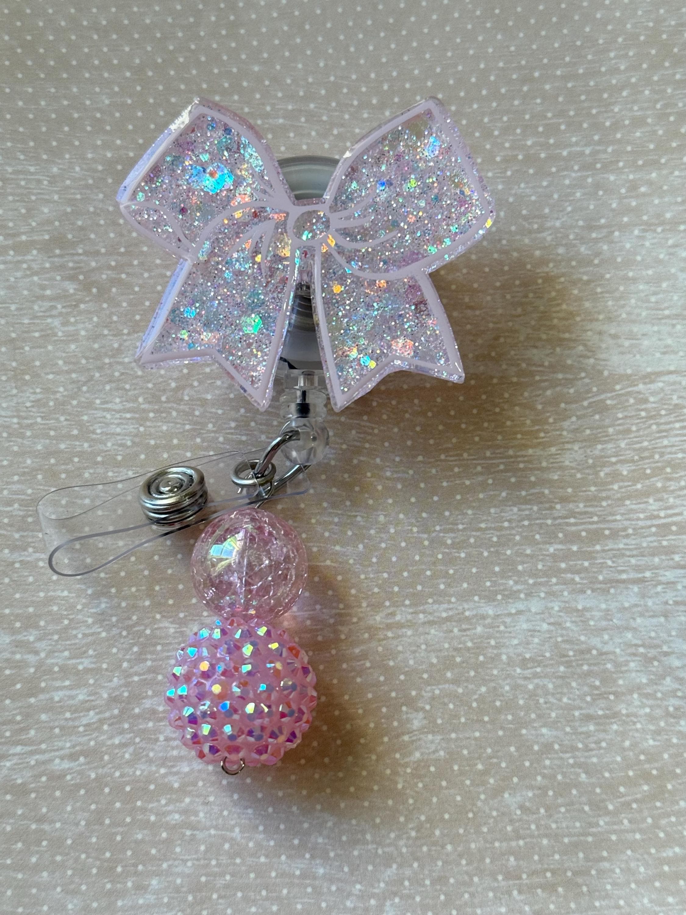 Bow badge reel swivel clip soft pink with beads