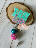 X-Ray  badge reel aqua and pink