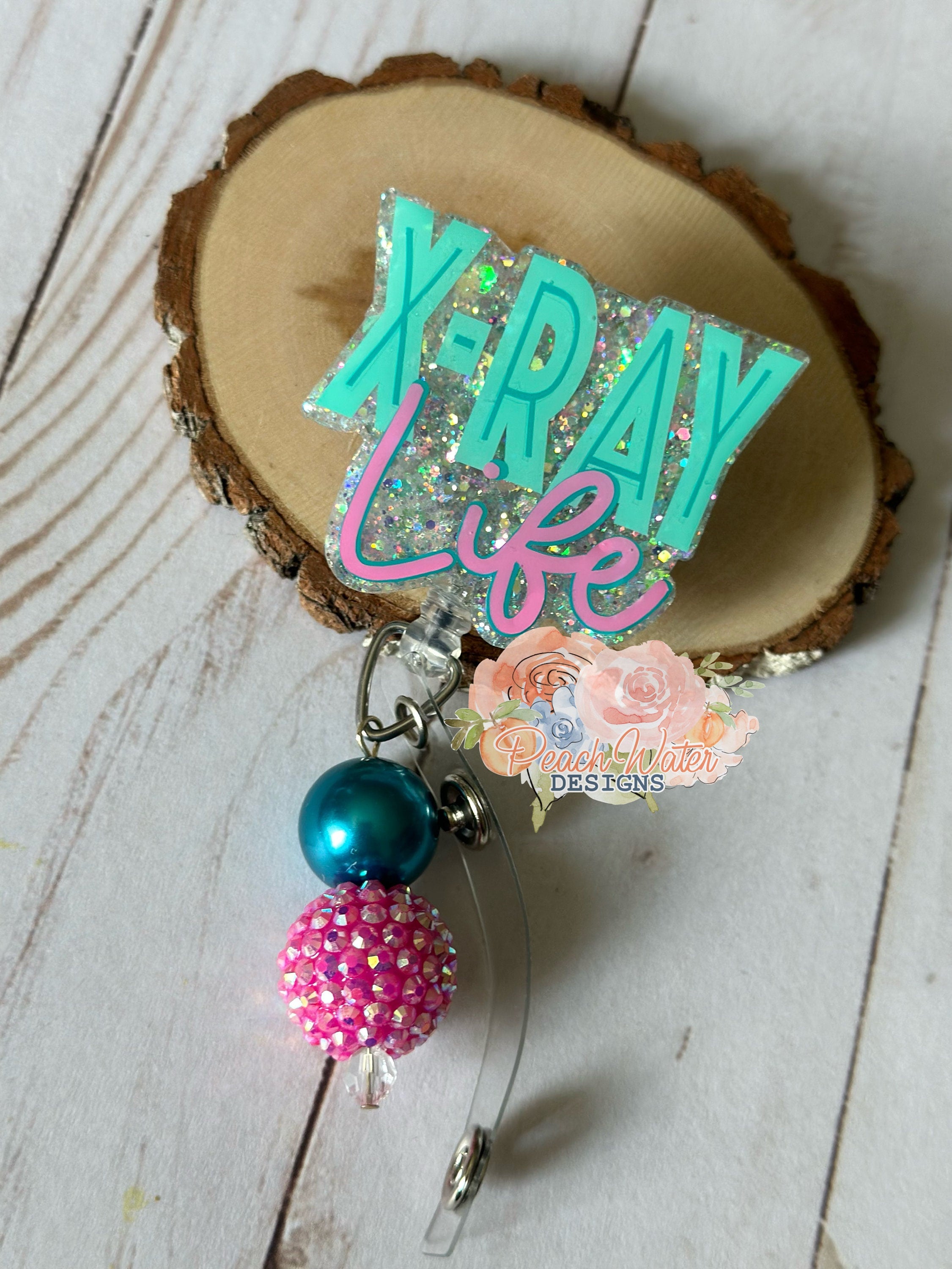X-Ray  badge reel aqua and pink