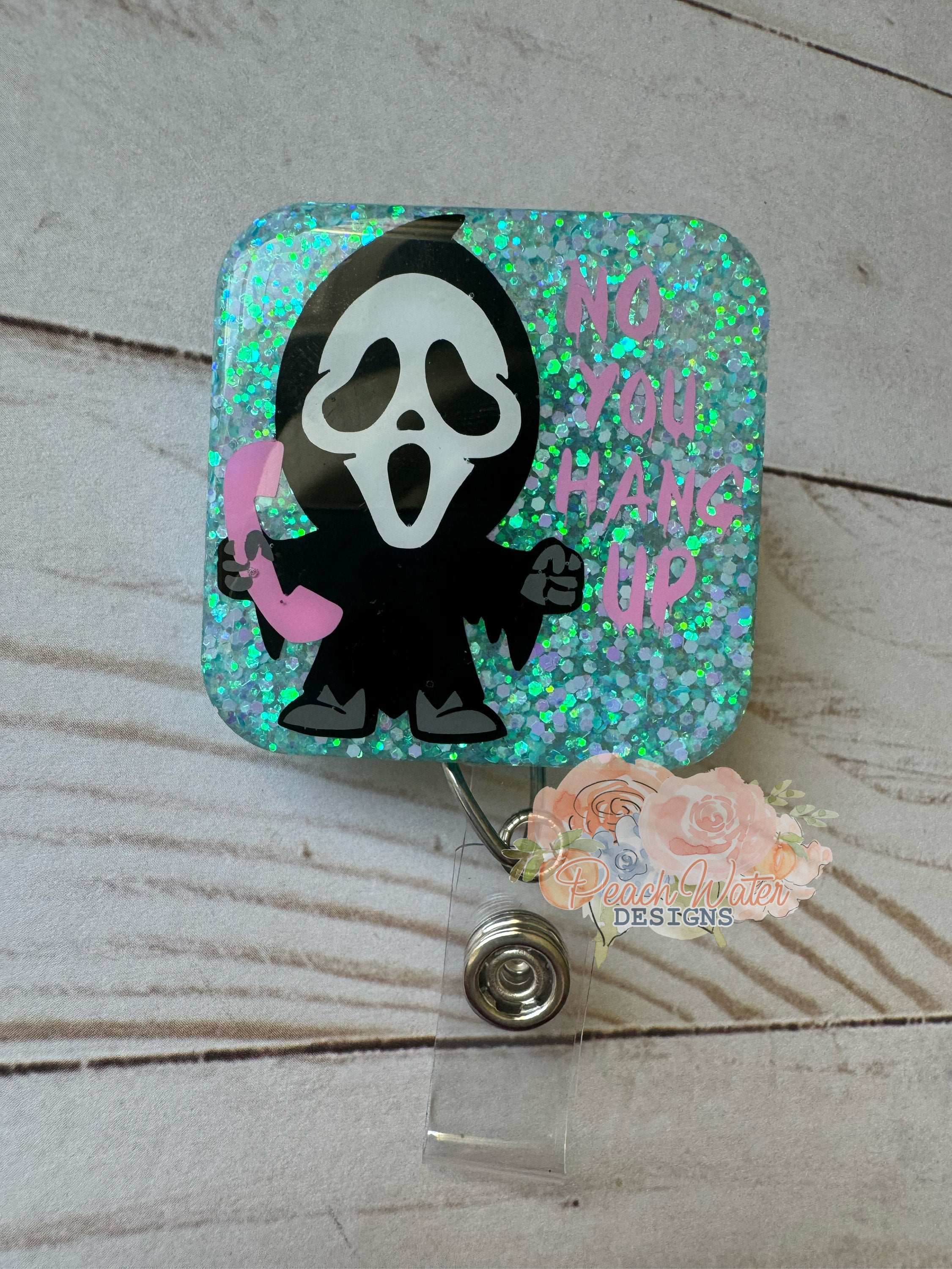 Scream Face phone aqua badge reel